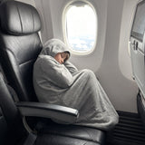 Enfant endormi en avion dans le Lumea Cocon